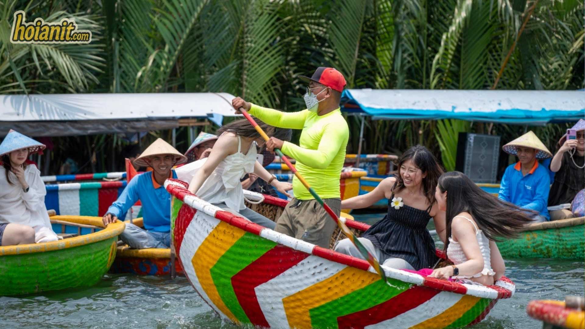 Guests being rowed through the nipa palms on a Hoi An basket boat ride