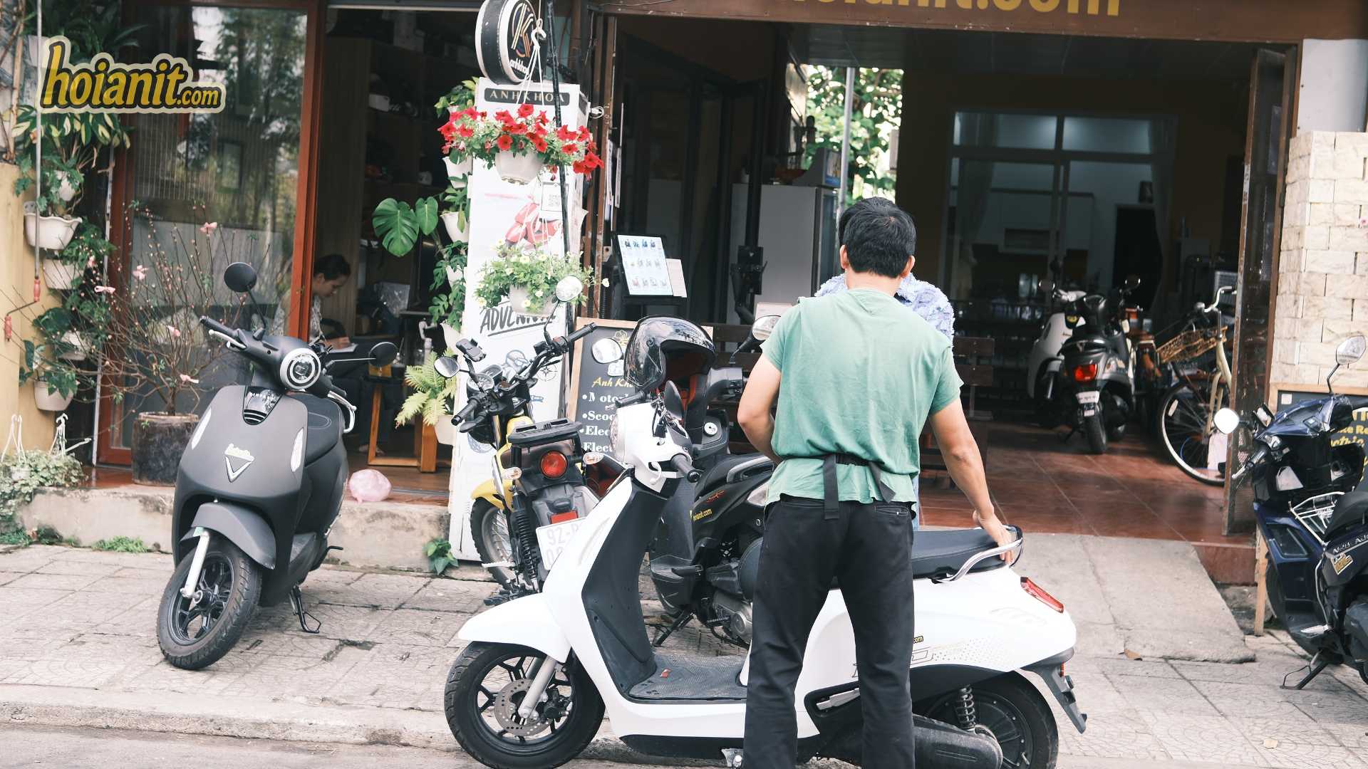 Bikes lined up outside the shop for Hoi An 50cc bike rental customers