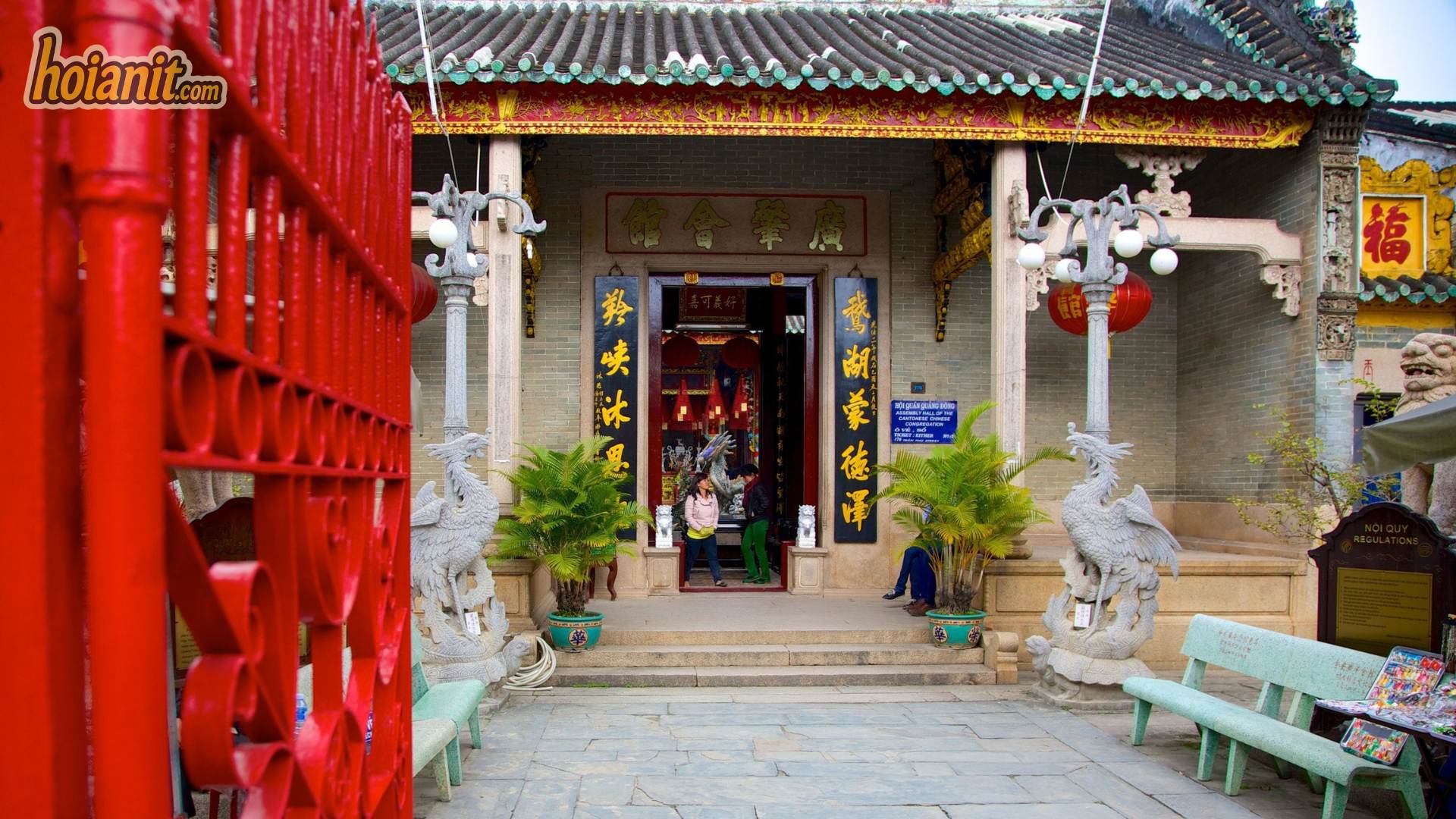Ceramic dragon and carp pond in the courtyard of the Cantonese Assembly Hall, Hoi An