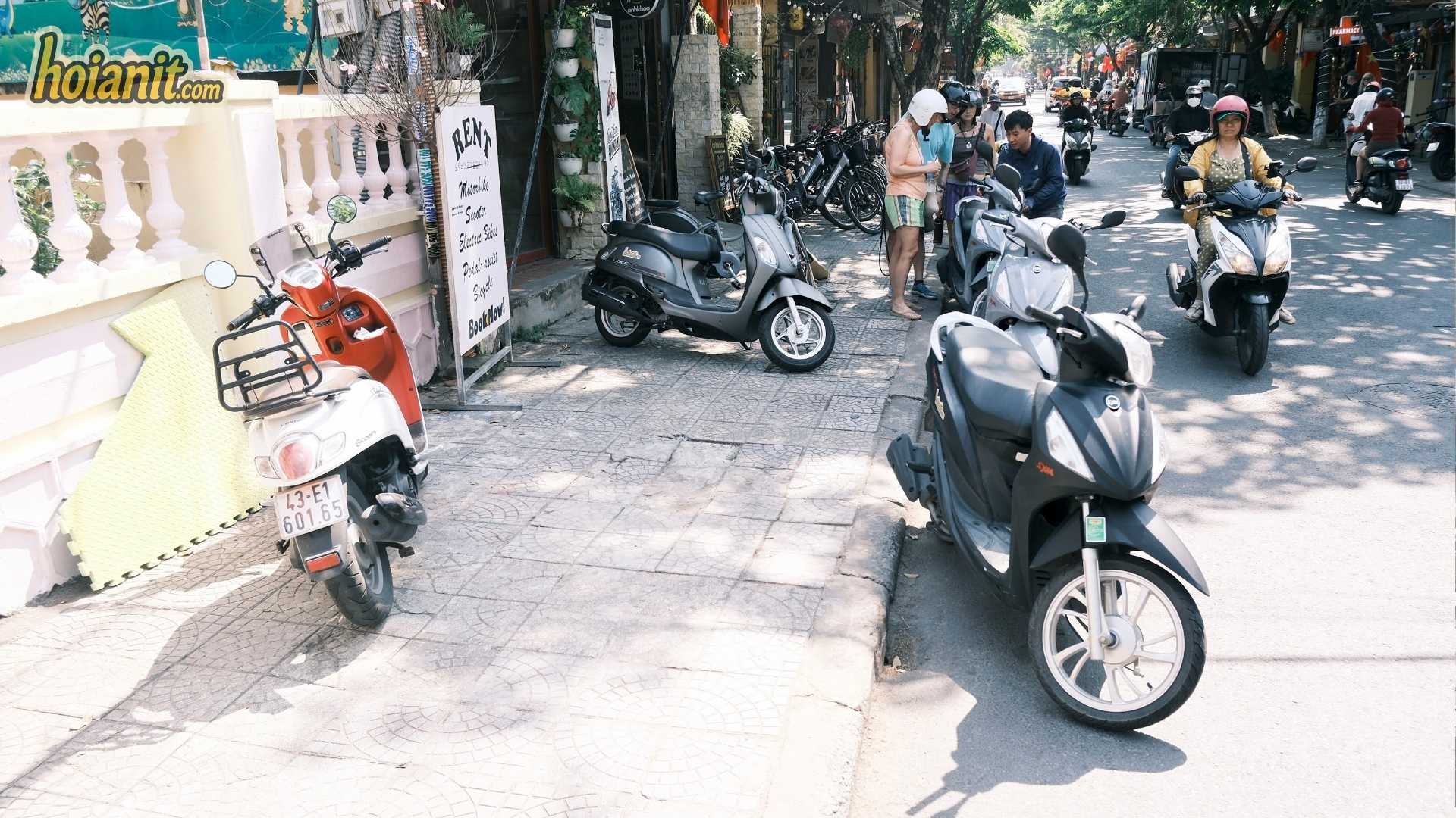 N95 Petrol in Vietnam3 Rental scooters parked on a Hoi An street, all running on E10 N95 petrol since June 2026