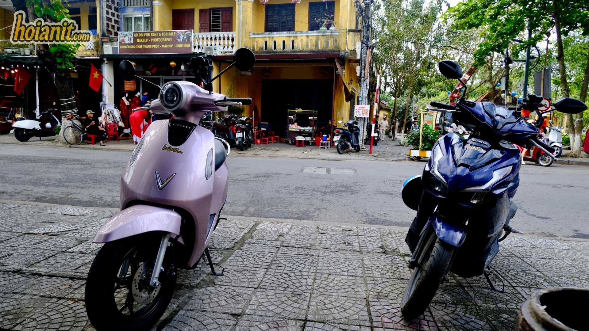 Need a License to Ride a Motorbike in Hoi An 1 Low-speed electric scooter and a larger motorbike parked on a street in Hoi An
