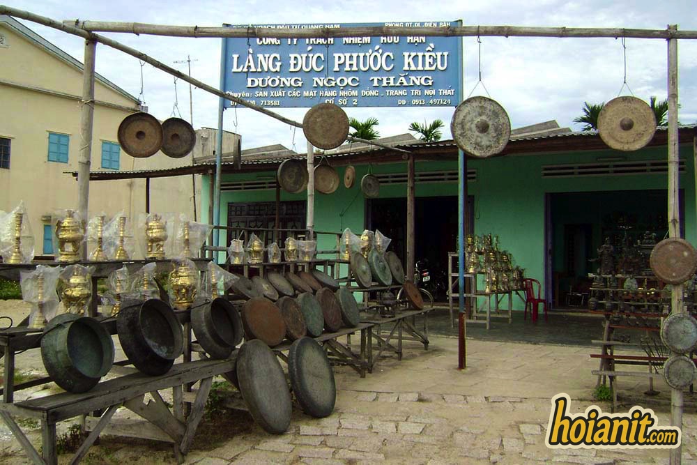 Phuoc Kieu bronze village Gongs hanging outside a family foundry in Phuoc Kieu bronze village, first stop on the Bang An Tower loop from Hoi An