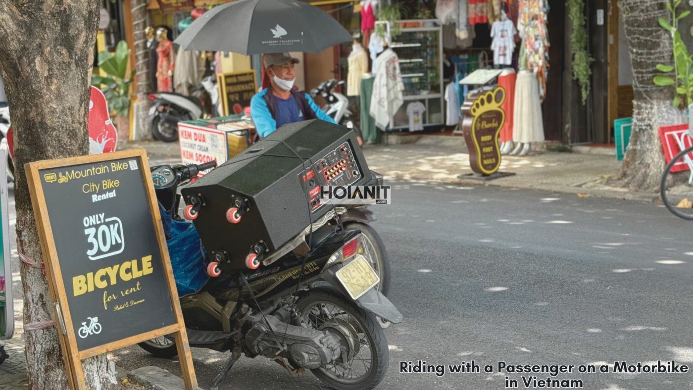 foreign travelers riding a motorbike with helmets in Vietnam