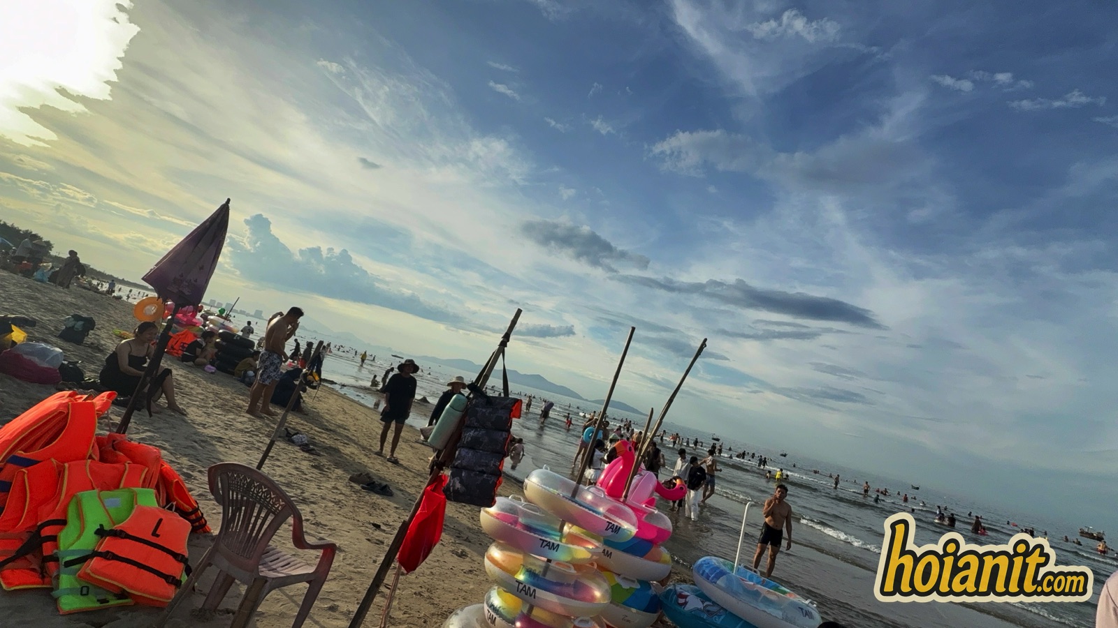 Sunbeds umbrellas and rental floats on An Bang Beach Hoi An