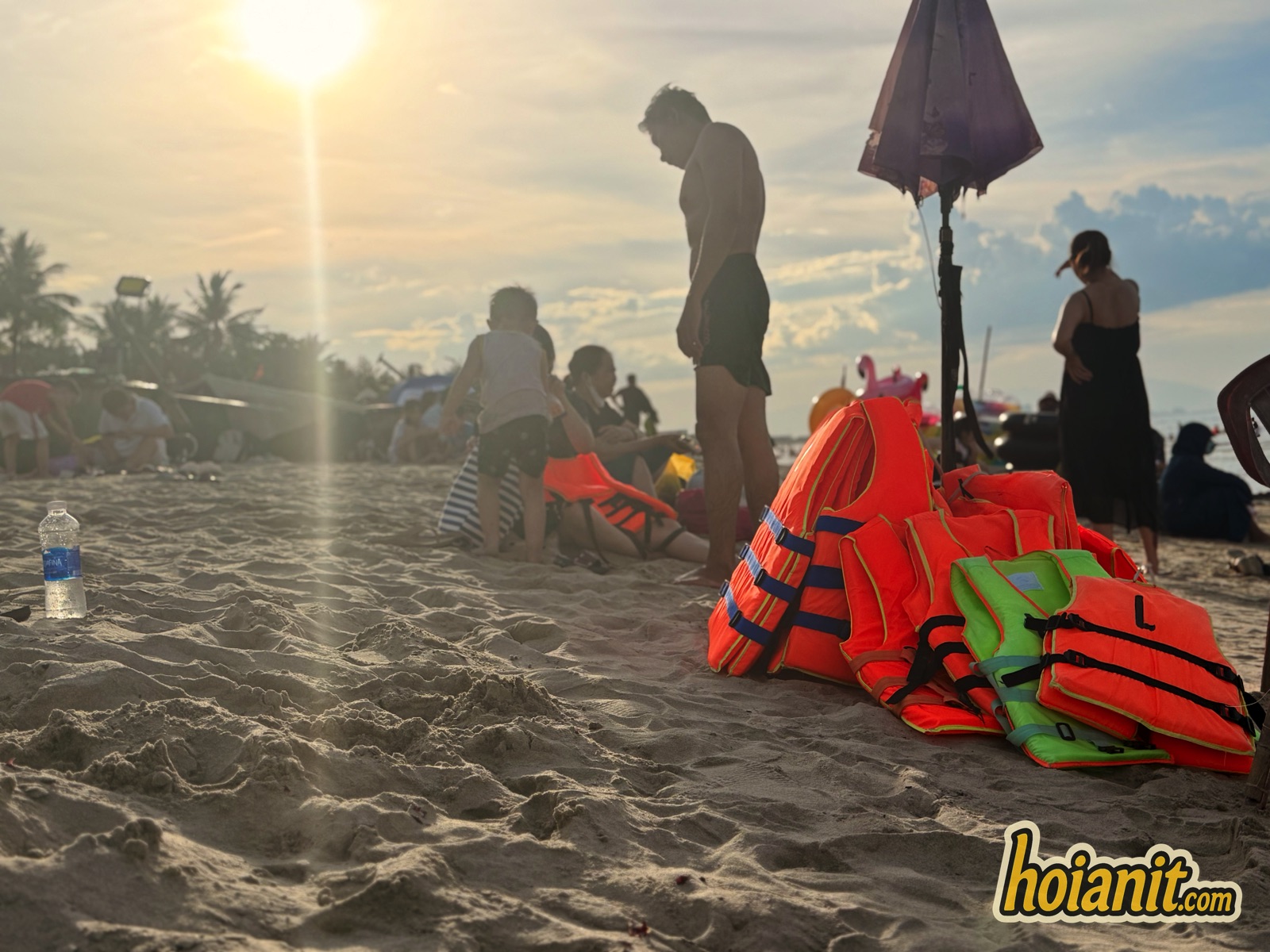 Life jackets stacked on the sand at An Bang Beach Hoi An at sunset