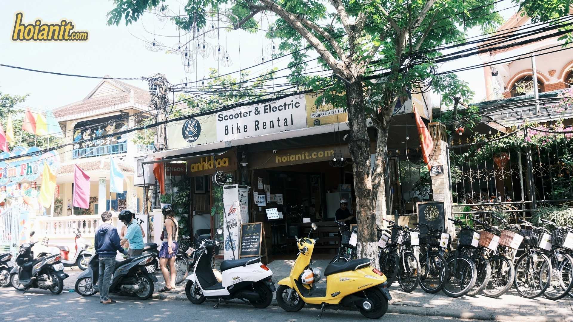 Scooter and electric bike rental shop front at 84 Phan Chau Trinh, Hoi An