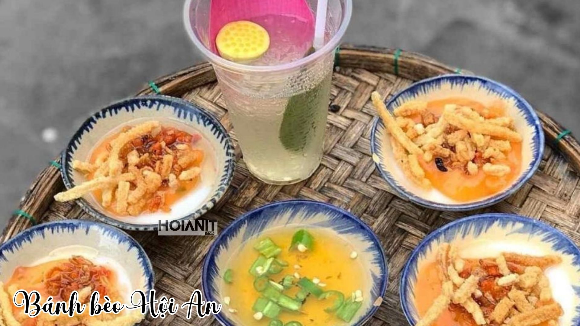 Saucers of banh beo rice cakes with dried shrimp and a glass of sugar-cane juice