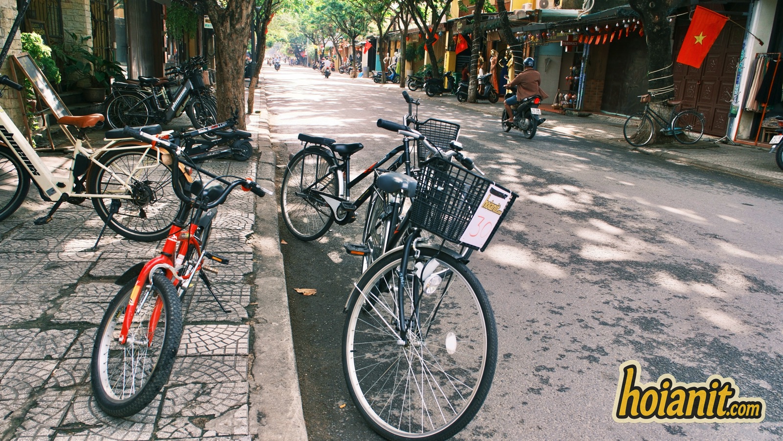 bicycle rental hoi an city bikes with basket 1 City bikes with baskets for Hoi An cycling routes parked on an Old Town street