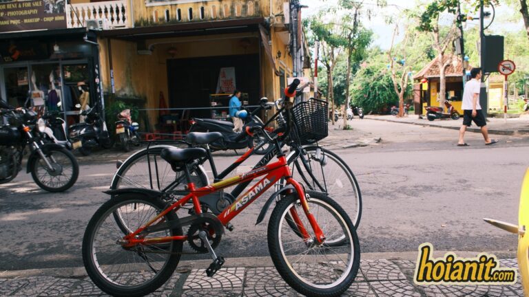 Rental bicycles parked on a street in Hoi An old town