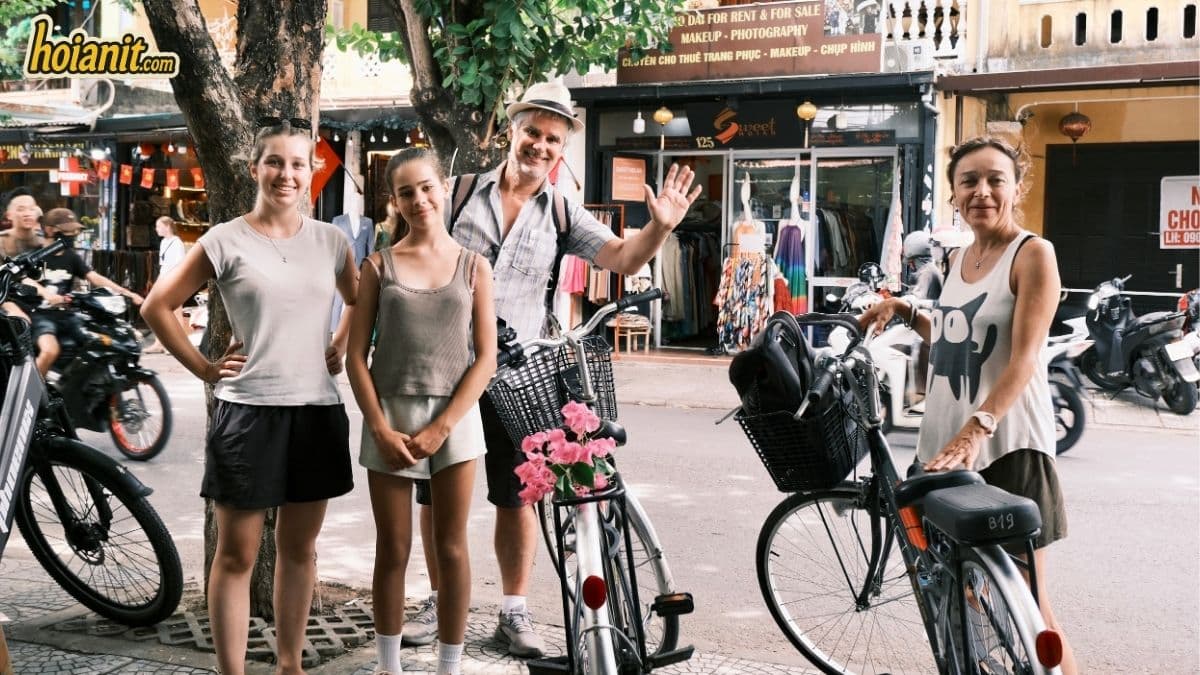 Family with rental bicycles from Anh Khoa on a Hoi An street