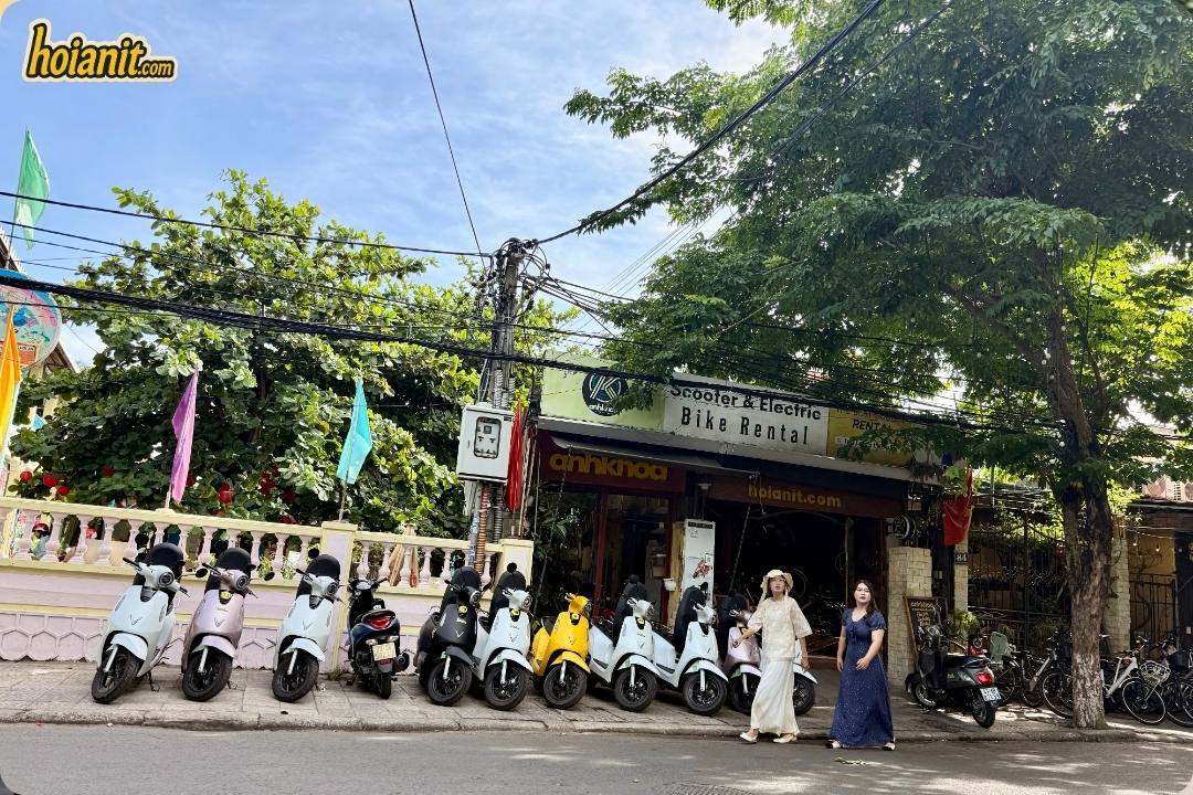The Anh Khoa Hoi An shop front with scooters lined up along the street