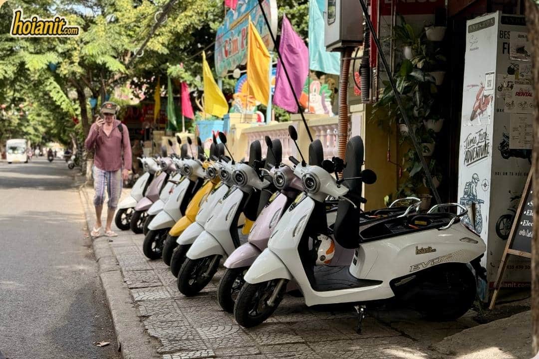 Row of white scooters parked outside the Anh Khoa Hoi An shop