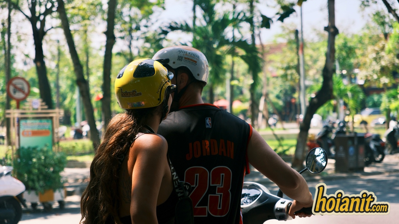 Couple with helmets on a scooter in Hoi An, the kind of bike an A1 license covers