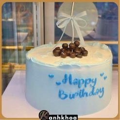 A beautifully decorated birthday cake with fresh fruits and creamy frosting from a bakery in Da Nang