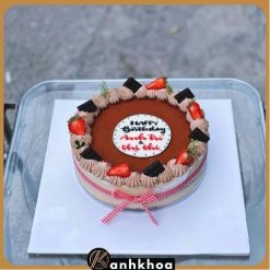 Freshly made tiramisu birthday cake from a Da Nang bakery, garnished with fruit