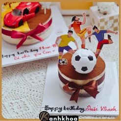 Elegant tiramisu birthday cake in Da Nang with cocoa powder and chocolate decorations.