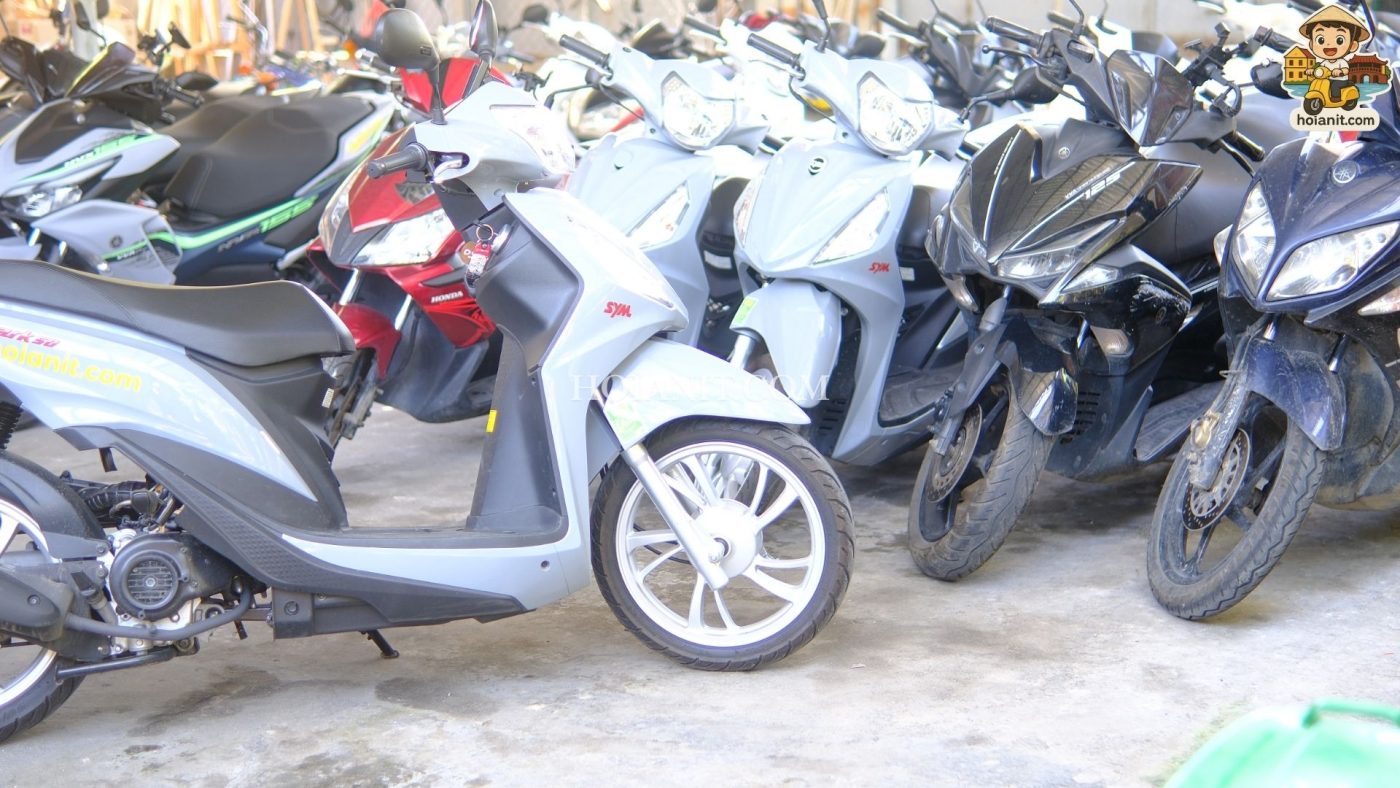 Row of second-hand motorbikes for sale in front of Anh Khoa Motorbike Hoi An