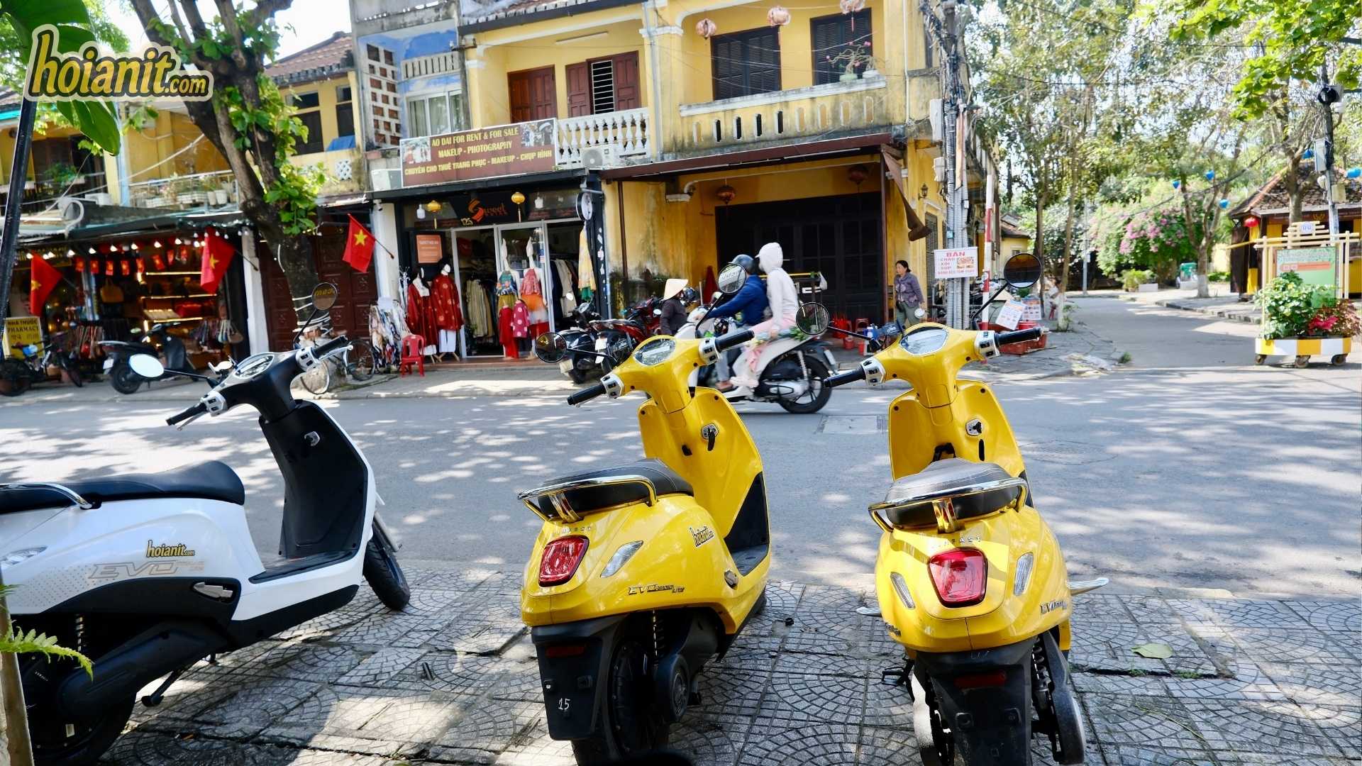 Tourist riding a license-free electric motorbike in Hoi An Vietnam