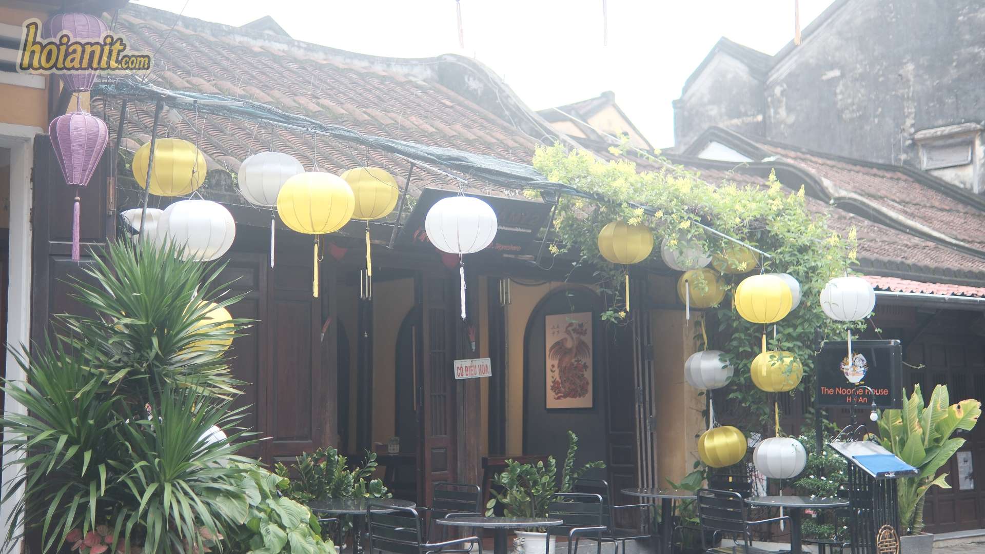 Silk lanterns hanging over a café terrace in the Hoi An hidden gem Old Town
