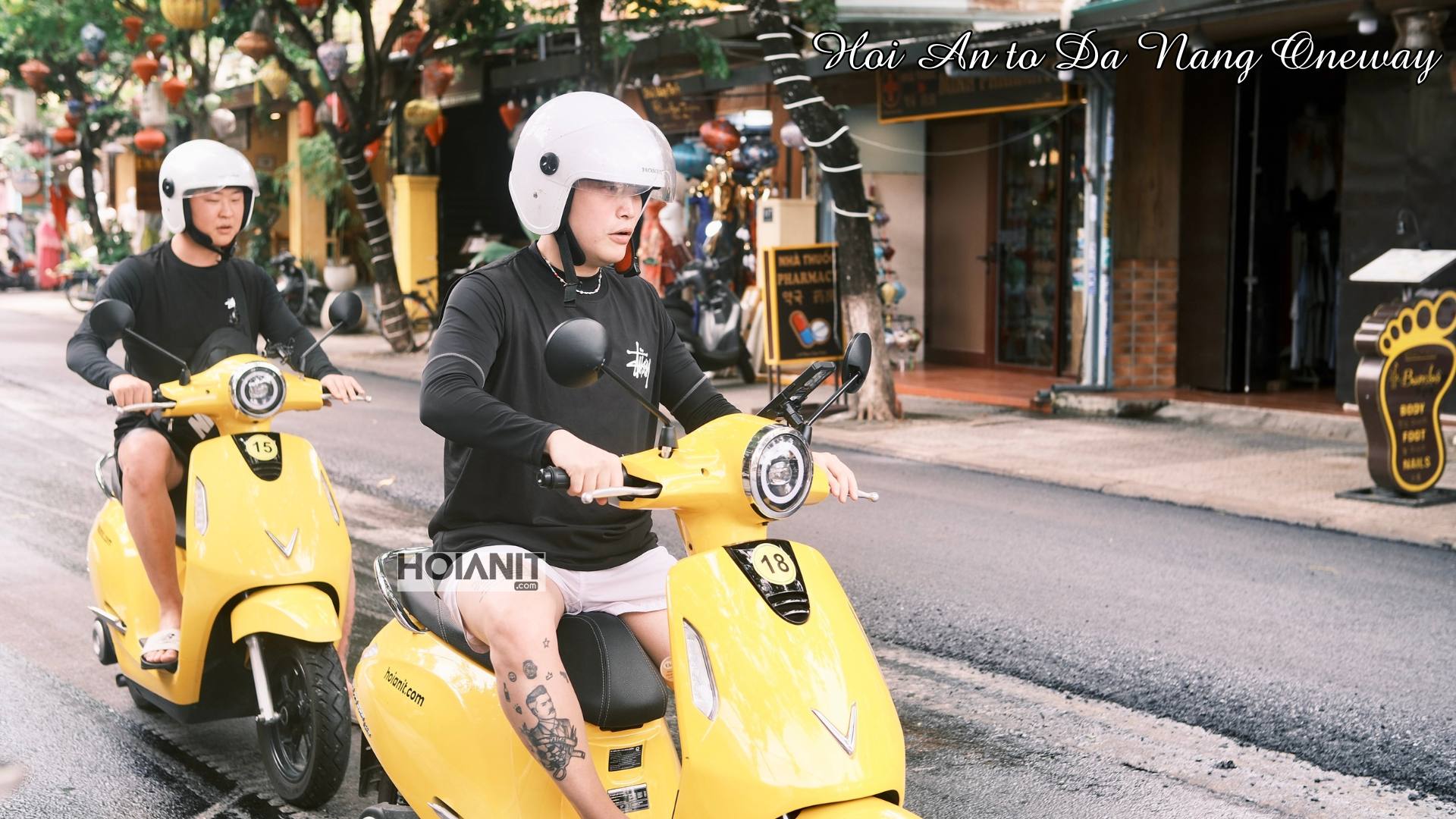 Two riders setting off on the Hoi An to Da Nang one way by scooter