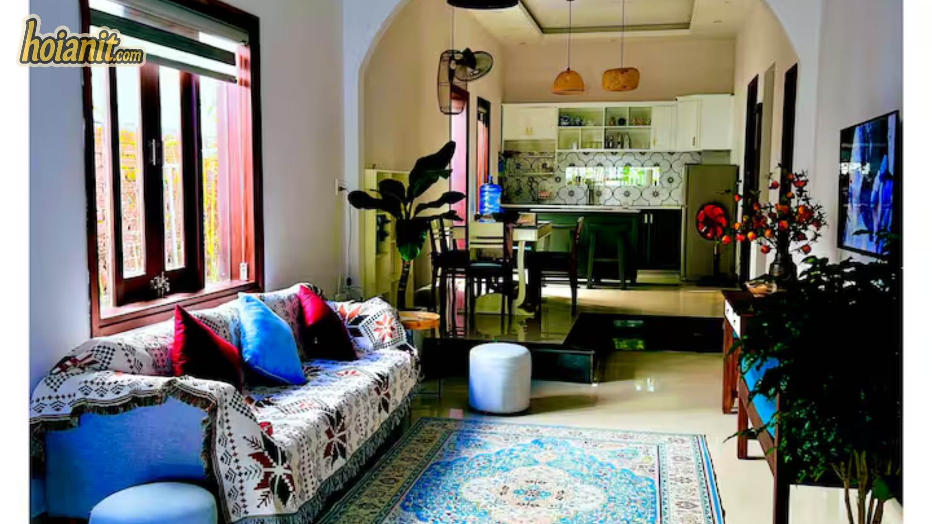 Living room of a rental house in Hoi An with kitchen behind