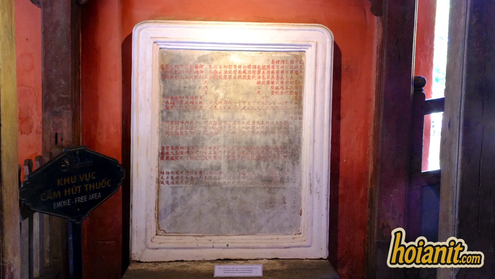 japanese covered bridge12 Old stone stele with Chinese characters inside the Japanese Covered Bridge, with an interpretation sign beside it