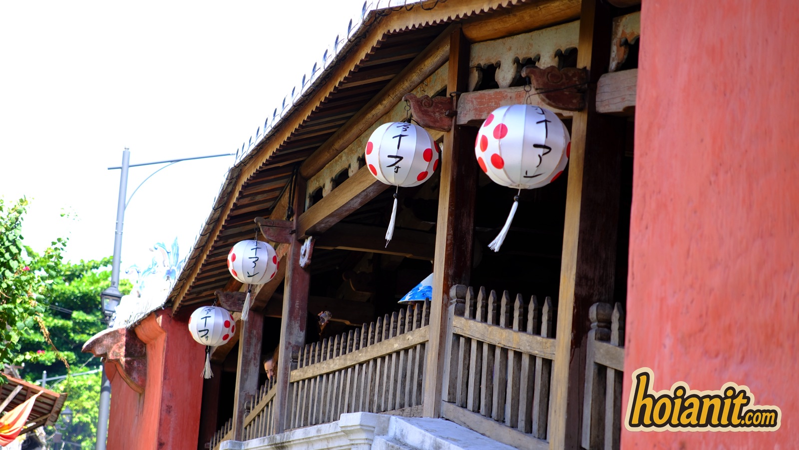 japanese covered bridge3 Inside the covered walkway of the Japanese Covered Bridge with wooden columns and hanging lanterns