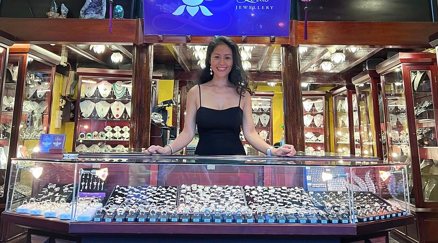 Handcrafted silver and gemstone jewelry displayed at a jewelry shop in Hoi An Ancient Town