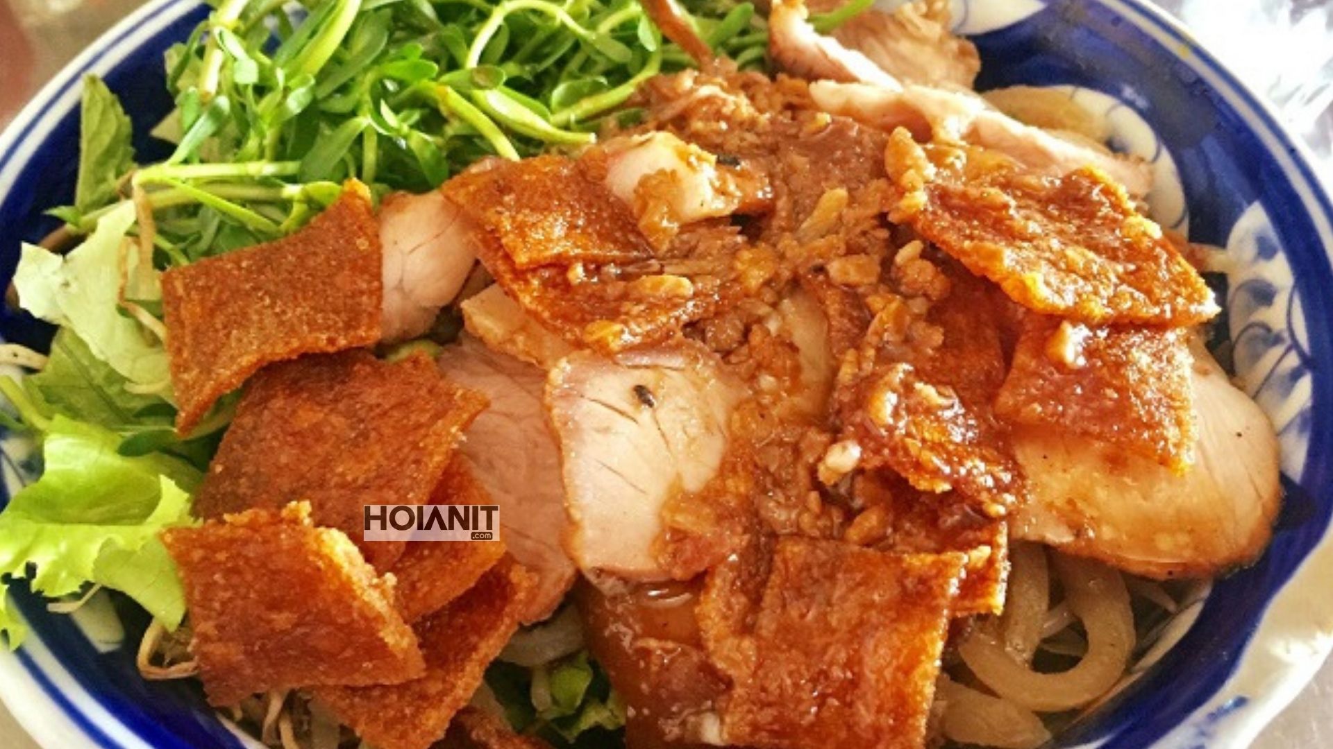 Cao lau served in a patterned bowl at a small local shop in Hoi An