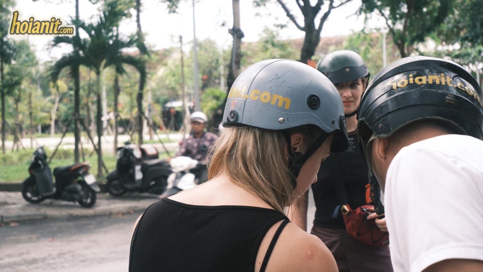 Checking helmets before a motorbike rental Bac Kan ride to Ba Be