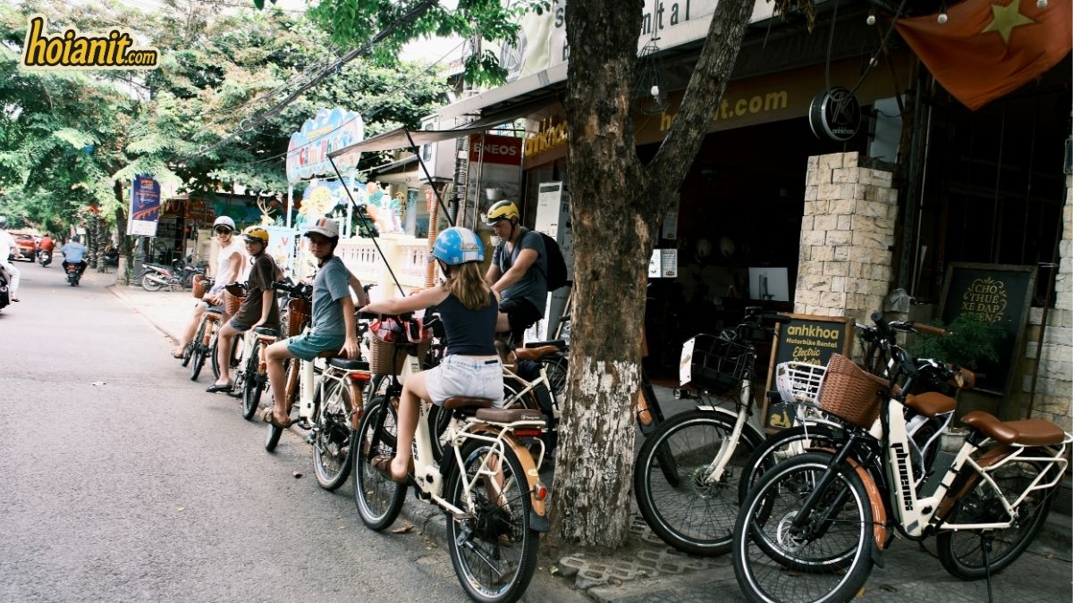 Row of electric bikes and bicycles ready to rent outside the Anh Khoa shop in Hoi An