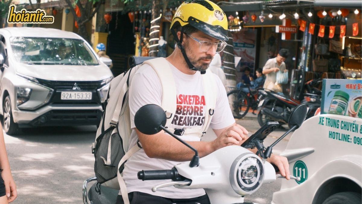 Headlight check before a night ride to the Dragon Bridge Da Nang
