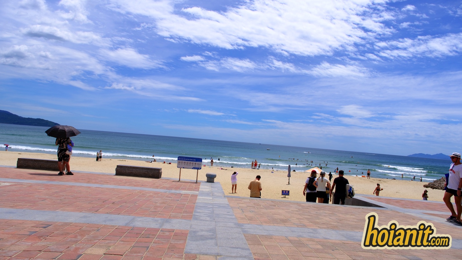 Tiled promenade and steps down onto the sand at My Khe Beach near Hoi An