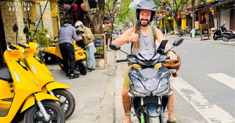 Happy rider on a rental scooter from Anh Khoa in Hoi An