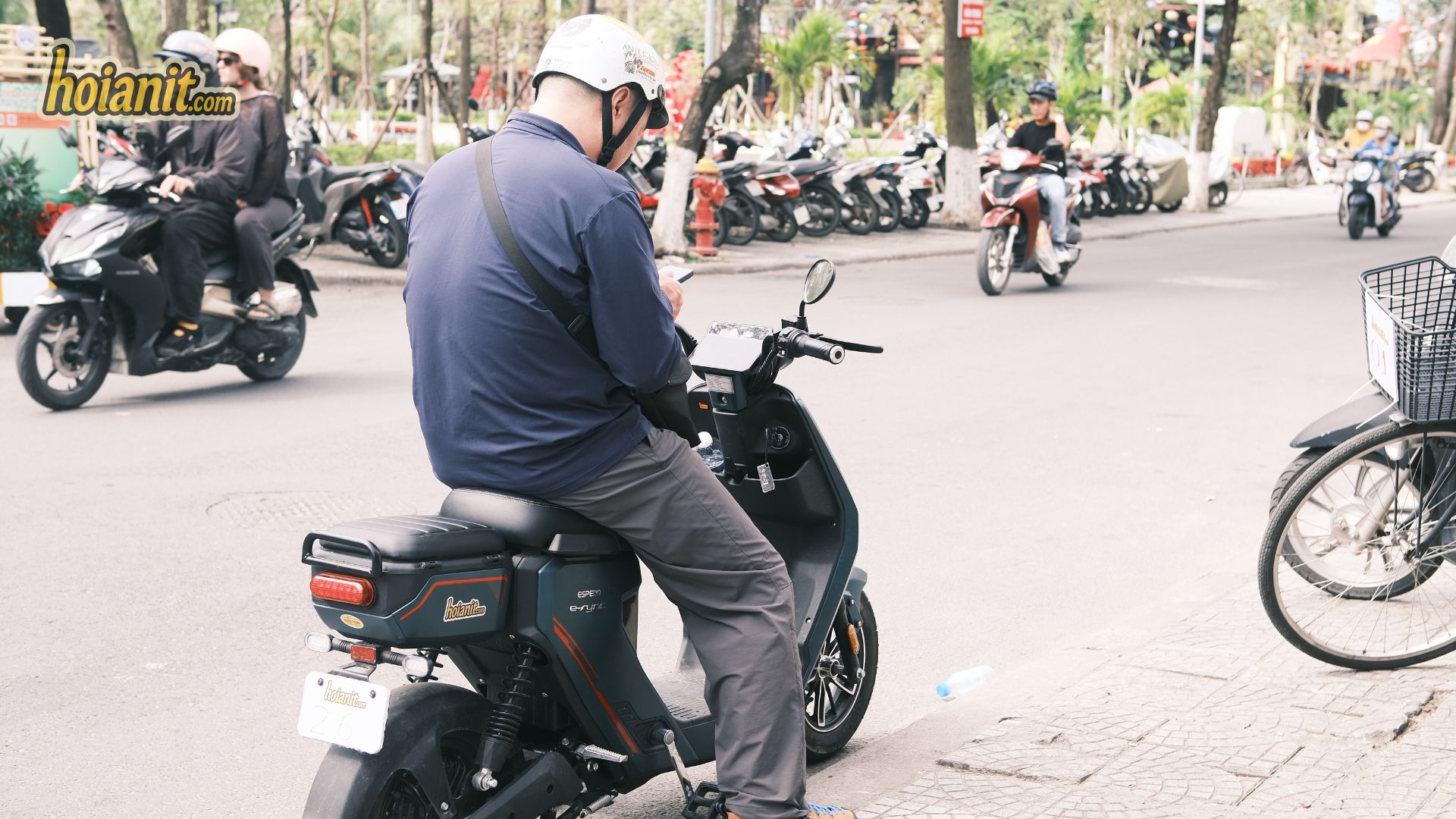 Riding a no-license electric scooter through the streets of Hoi An
