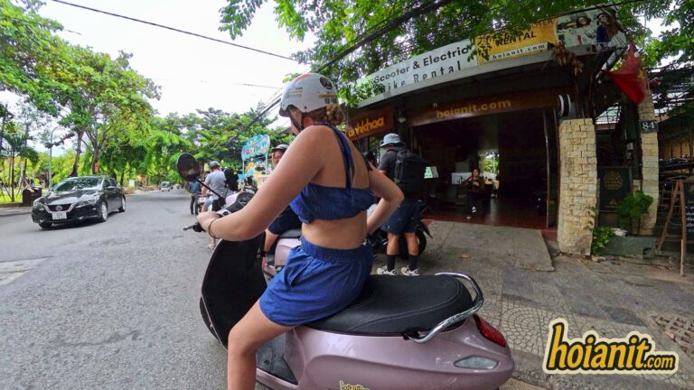 Tourist riding an electric scooter rented from Anh Khoa in Hoi An