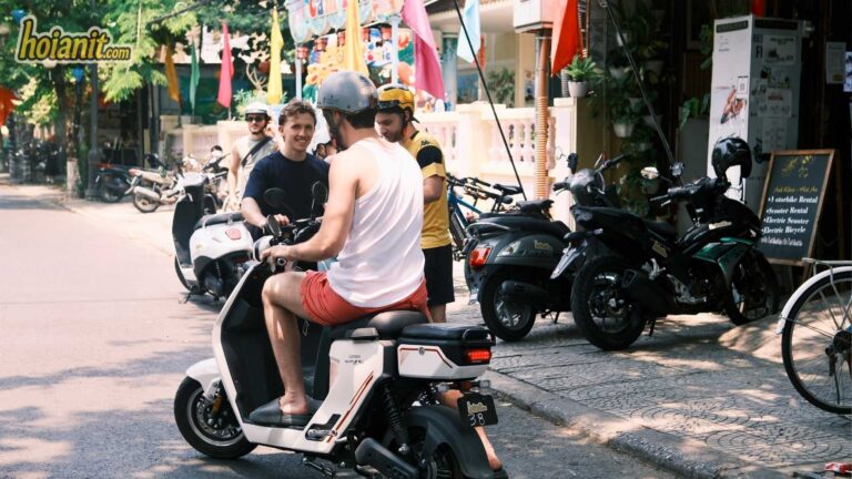 Tourists riding a Mini Electric Scooter from the Anh Khoa shop in Hoi An
