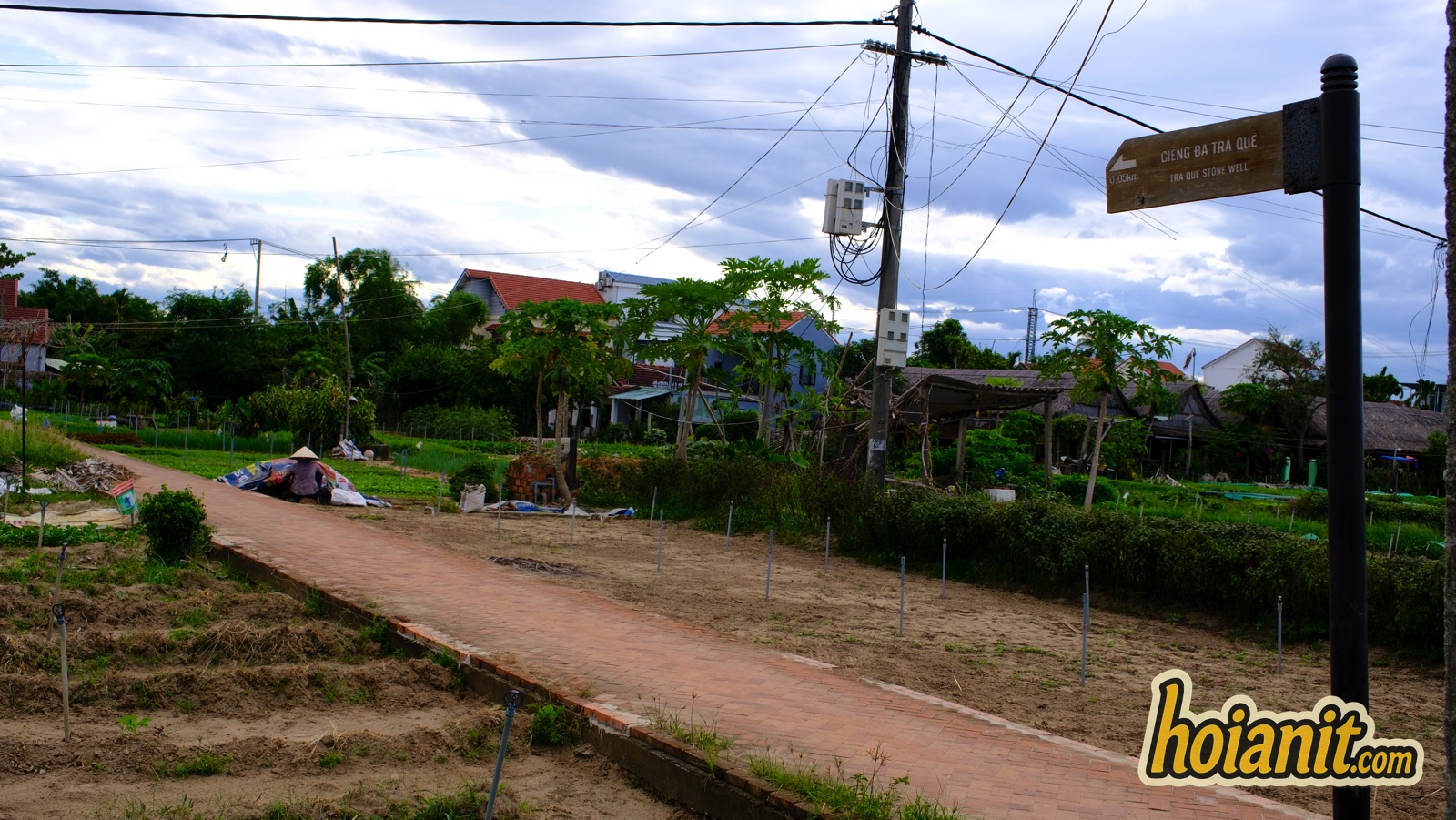 tra que vegetable village12 Dirt lane with wooden signpost at Tra Que vegetable village
